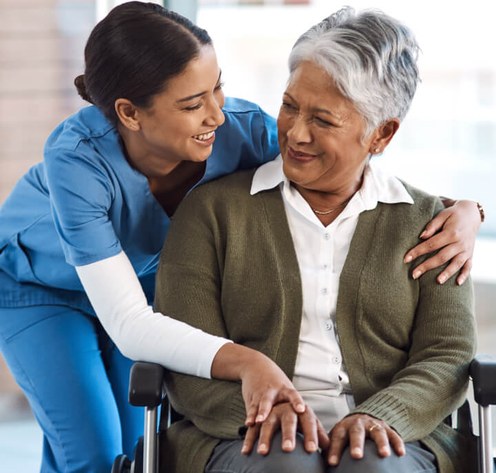 Cropped shot of a young female nurse with a senior wheelchair-bound patient.